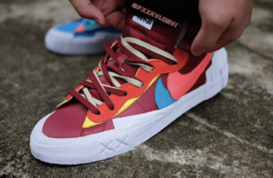 Alternative view of Giày Nike KAWS x sacai x Blazer Low 'Team Red' DM7901-600