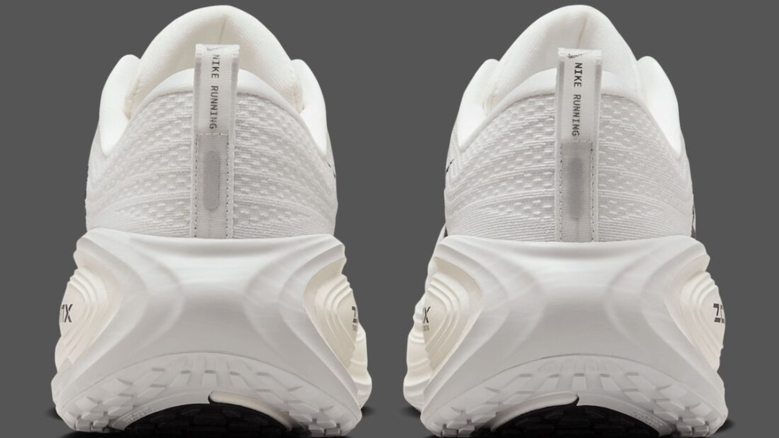 Hinh anh 4: Hinh anh Nike Vomero Plus Reverse Swoosh voi thiet ke Swoosh nguoc doc dao