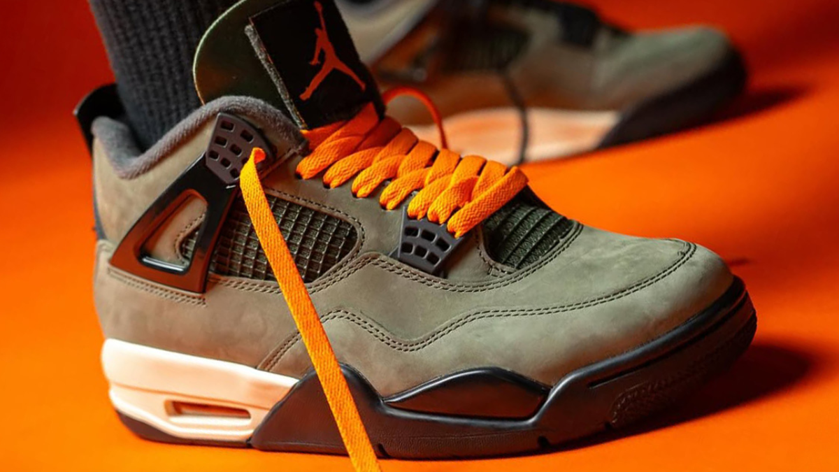 Undefeated x Air Jordan 4 voi thiet ke da lon olive va luoi cam